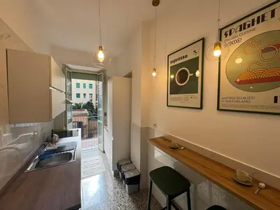 a kitchen with a sink and a counter with a window at Flaminia Apartment - Metro A in Rome