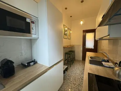 a small kitchen with a sink and a microwave at Flaminia Apartment - Metro A in Rome