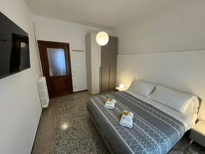 a bedroom with a bed with two stuffed animals on it at Flaminia Apartment - Metro A in Rome
