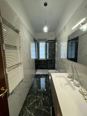a bathroom with two sinks and a large mirror at Flaminia Apartment - Metro A in Rome