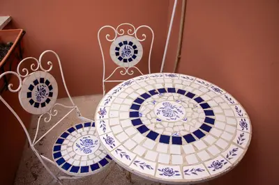 three blue and white plates sitting on a shelf at Peck House in Marconi San Paolo in Rome