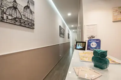 a museum exhibit with a green vase on a table at Elenoire Rooms & Suite in Rome