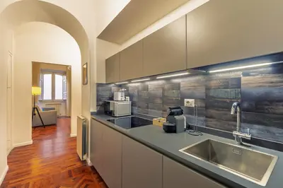 a kitchen with a sink and a counter top at Domus Flavia Monti in Rome