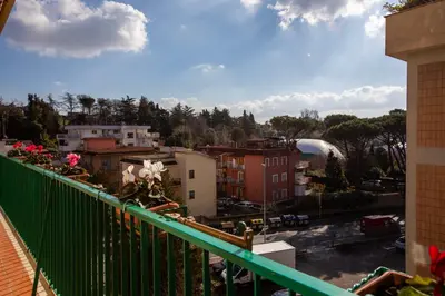 a balcony with a view of a city at Roots of Rome Apartment in Rome