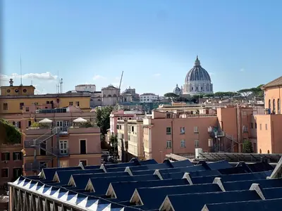 a view of roofs of buildings in a city at Dome View in Rome
