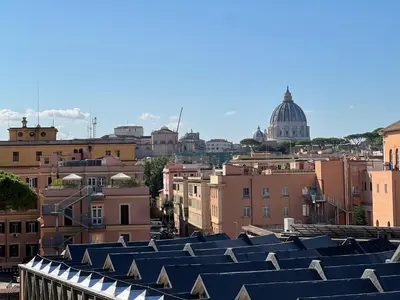 a view of roofs of buildings in a city at Dome View in Rome