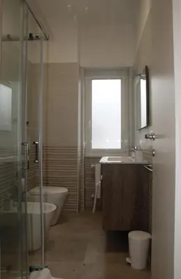 a bathroom with a tub and a toilet and a sink at Viva la vida in Rome in Rome