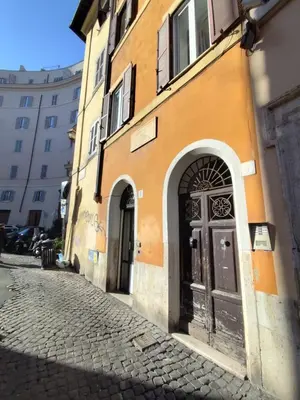 a building with a door on the side of a street at Bijoux de Rome Campo dei Fiori Apart in Rome