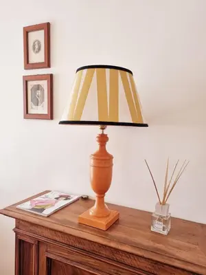 a lamp sitting on top of a wooden table at Via Veneto Cosy House in Rome