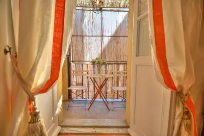 an open door to a room with a window at Via Veneto Cosy House in Rome