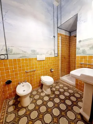 a bathroom with a toilet and a sink and a tub at Via Veneto Cosy House in Rome
