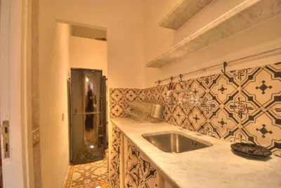 a kitchen with a sink and a shower at Via Veneto Cosy House in Rome