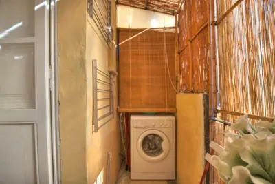 a laundry room with a washing machine in it at Via Veneto Cosy House in Rome