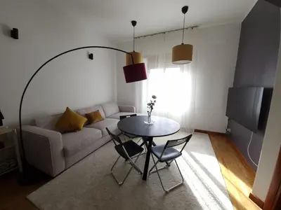 a living room with a table and a couch at La dolce vita in Rome - Guest House in Rome
