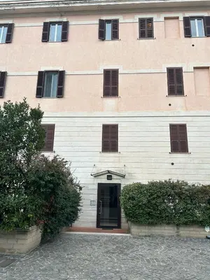 a large building with a door in front of it at La terrazza di Baccio - Baccio's Terrace in Rome