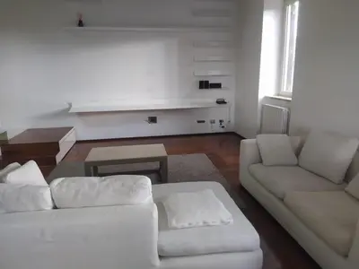 a living room with two white couches and a table at La terrazza di Baccio - Baccio's Terrace in Rome