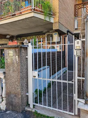 a gate in front of a building at La Casetta A Monti Di Creta in Rome