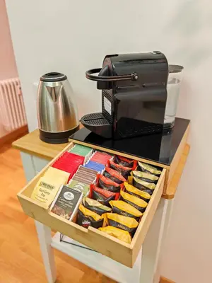 a table with a box of food and a toaster at La Casetta A Monti Di Creta in Rome