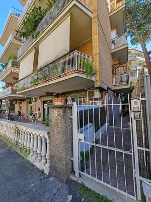 a building with a gate in front of it at La Casetta A Monti Di Creta in Rome