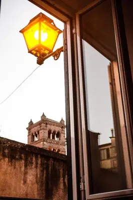 a view of a building seen through a window at Scent Of Trastevere in Rome