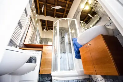 a bathroom with a shower and a sink at Scent Of Trastevere in Rome