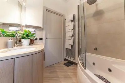 a bathroom with a sink and a shower at Il Nido di Roma - Ospedale Gemelli & Garden in Rome