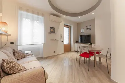 a living room with a couch and a table at Il Nido di Roma - Ospedale Gemelli & Garden in Rome