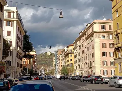 a busy city street with cars parked on the street at New Comfortable 2 Br Della Vittoria by Halldis in Rome