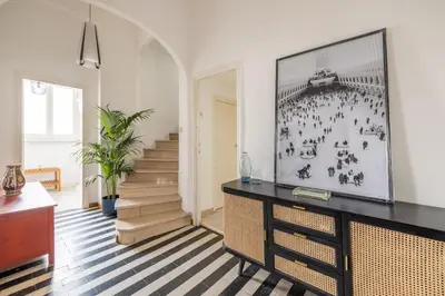 a living room with a television on a dresser at Elegant Penthouse with Terrace in Rome