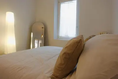 a bedroom with a large bed with pillows on it at Lussuosa Casa nel cuore di Trastevere in Rome