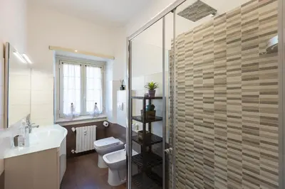 a bathroom with a toilet and a sink and a shower at Altavilla by Rental in Rome in Rome