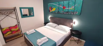 a bedroom with a bed with two towels on it at San Peter Vatican City quiet and lovely apartment in Rome