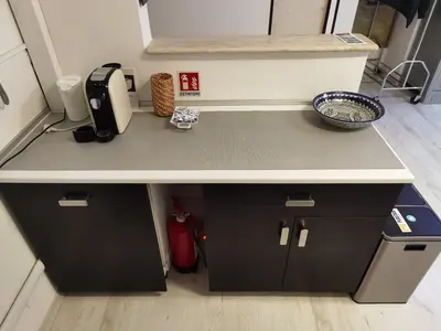 a kitchen counter with a sink and a bowl on it at Ballarin Studio Apartment for Business Travels and Holidays in Rome