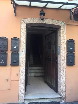 a door leading into a building with a staircase at Angelo ai Musei Vaticani studio in Rome
