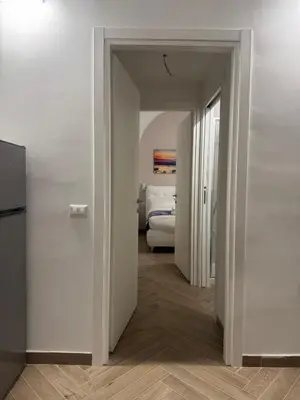 a hallway with a room with a bed in it at Munsi Vatican House in Rome