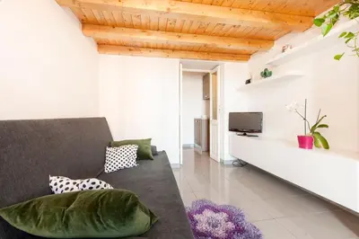 a living room with a couch and a tv at Cozy House near Termini Station - San Lorenzo in Rome