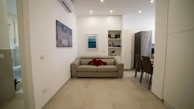 a living room with a couch and a table at Bliss House near Vatican City in Rome