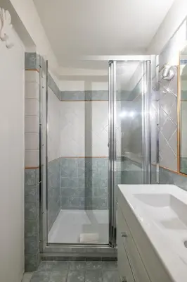 a bathroom with a shower and a sink at Ombrellari Secret Terrace in Rome
