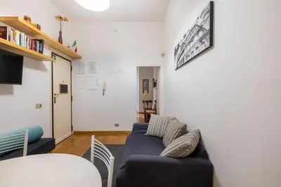 a living room with a couch and a table at Ombrellari Secret Terrace in Rome
