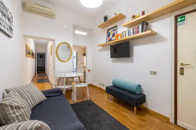 a living room with a couch and a table at Ombrellari Secret Terrace in Rome