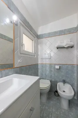 a bathroom with a tub and a toilet and a sink at Ombrellari Secret Terrace in Rome