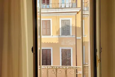 an open window with a view of a building at Monti Charming Apt Boschetto in Rome