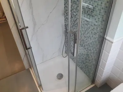 a shower with a glass door and a glass shower at Gallia in Rome