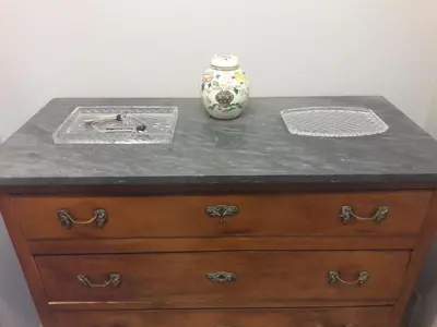 a vase sitting on top of a wooden dresser at Gallia in Rome