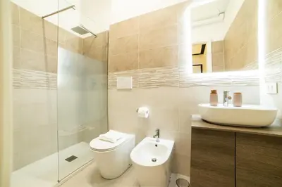 a bathroom with a toilet and a sink at The Pope's House in Rome