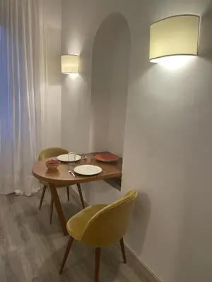 a white bathroom with a toilet and a sink at Centro Roma Cortile - LOCAPPART in Rome