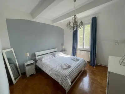 a white bedroom with a bed and a window at Appartamento casa Vittoria Centro citt vicino allo stadio olimpico in Rome