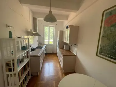 a kitchen with white cabinets and a sink at Appartamento casa Vittoria Centro citt vicino allo stadio olimpico in Rome