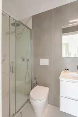 a bathroom with a shower and a toilet and a sink at Sunset House - San Paolo in Rome