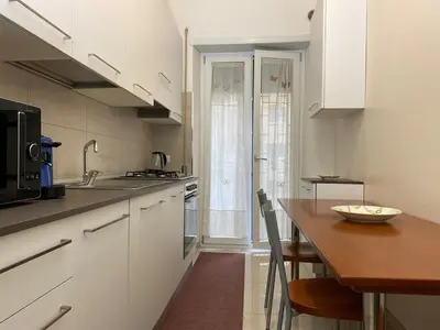 a kitchen with a stove top in a kitchen at Dimora Davide in Rome